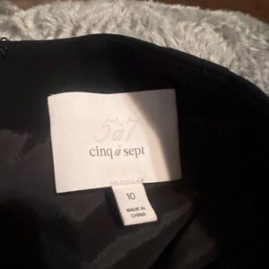 Sophisticated & Stylish: Cinq à Sept Black Skirt with Unique Accents! Size 10